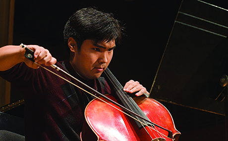 student performing on the cello